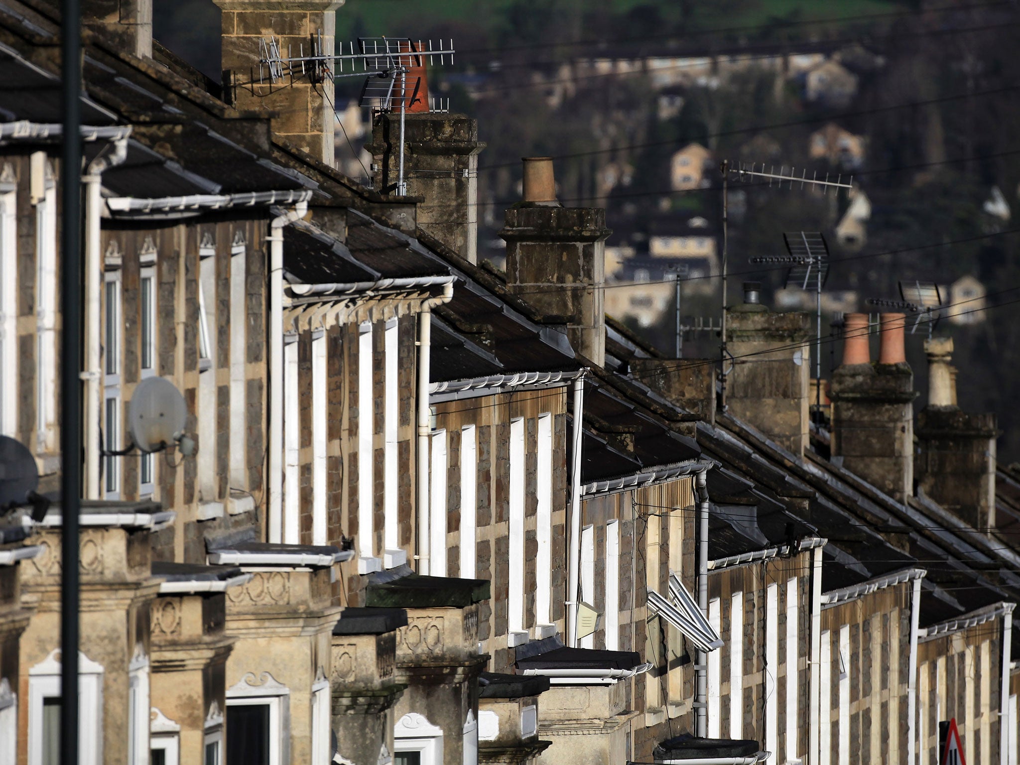 The winter sun illuminates houses in a residential street on January 2, 2012 in Bath, England.
