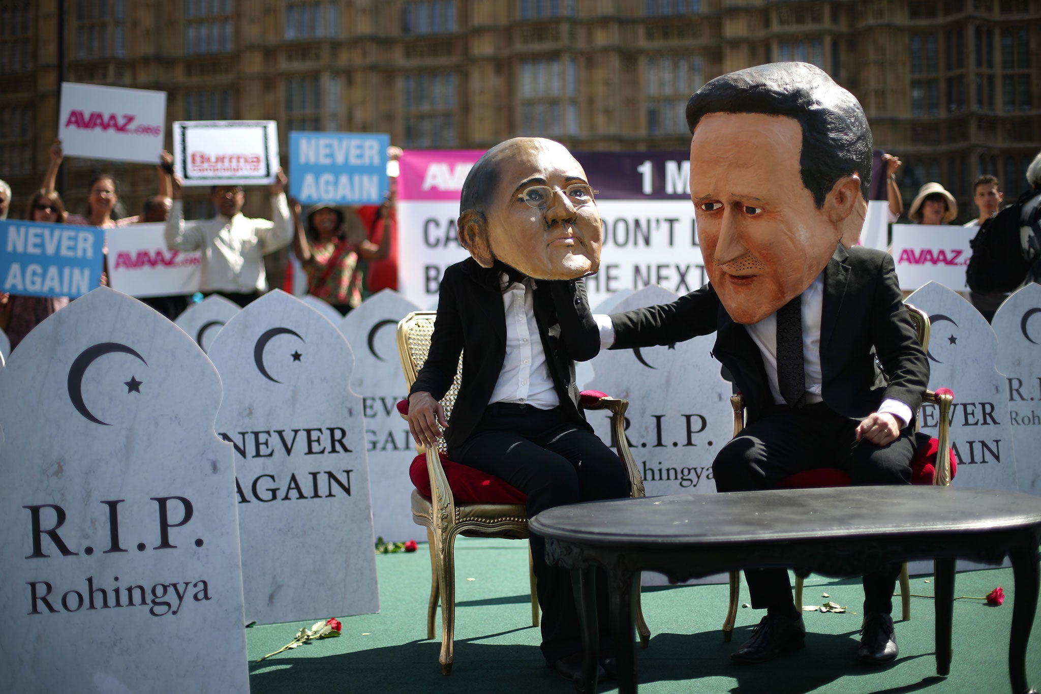 Protesters dressed as David Cameron and Thein Sein outside parliament in July