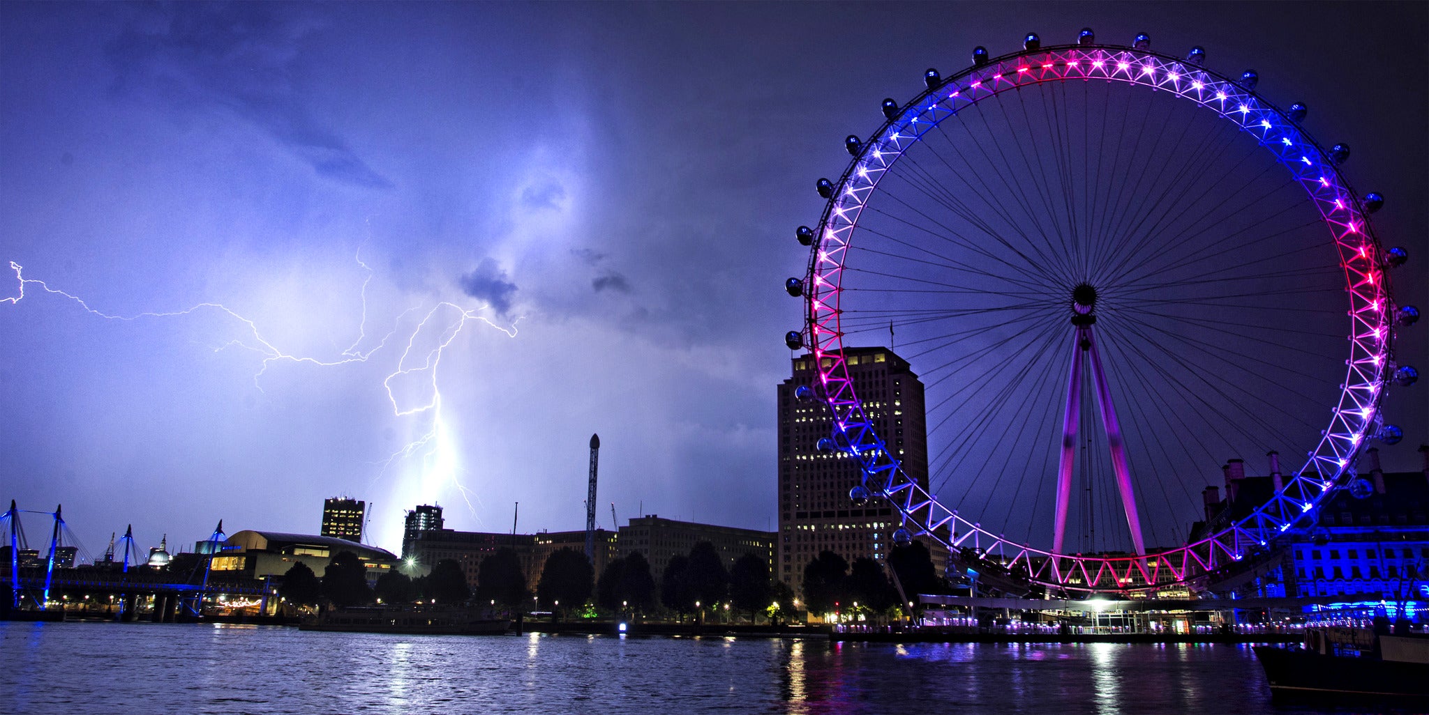 Lightning strikes behind The London Eye