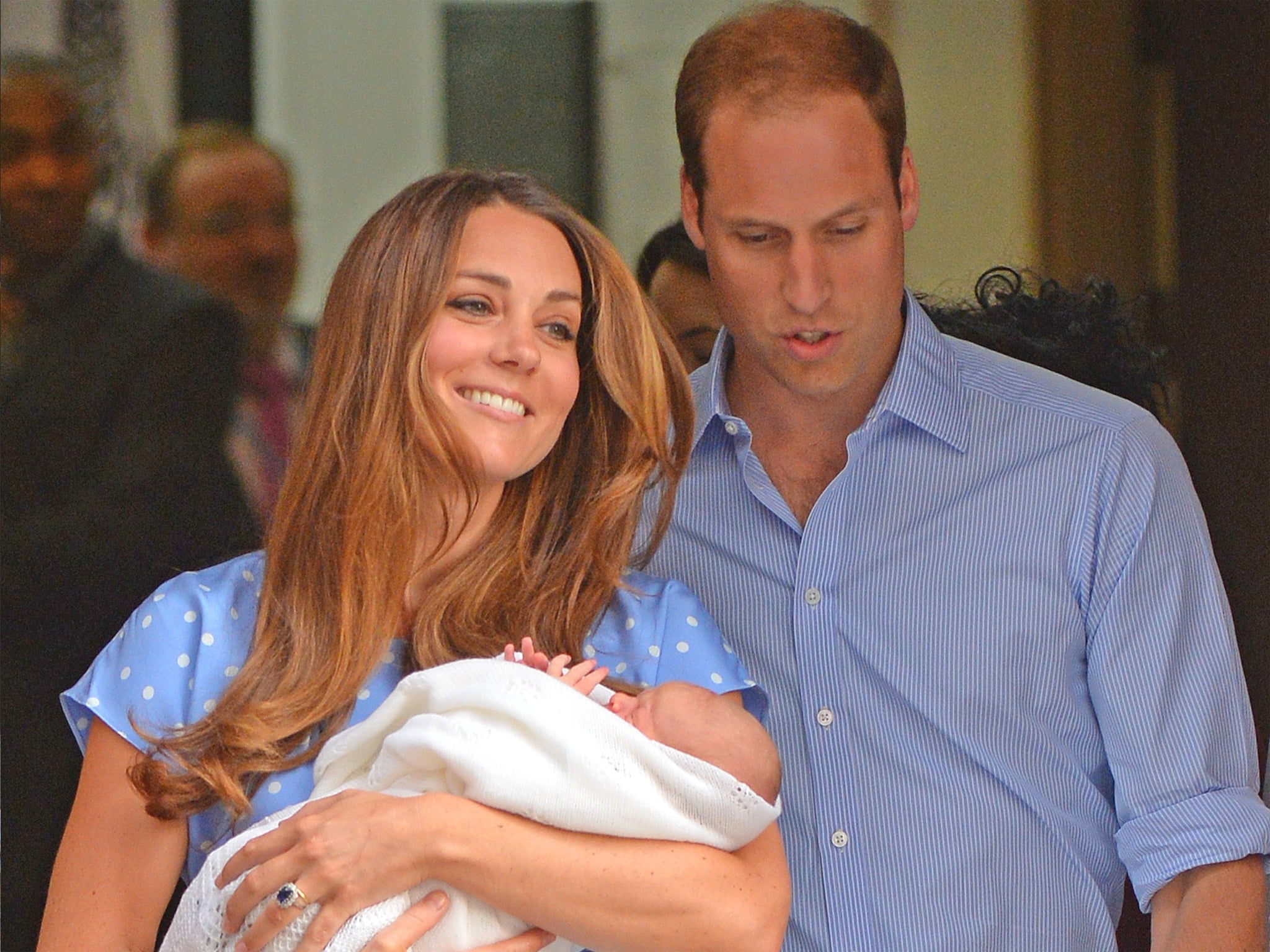 Prince William and Kate, Duchess of Cambridge, emerge from St Mary's with their newborn son