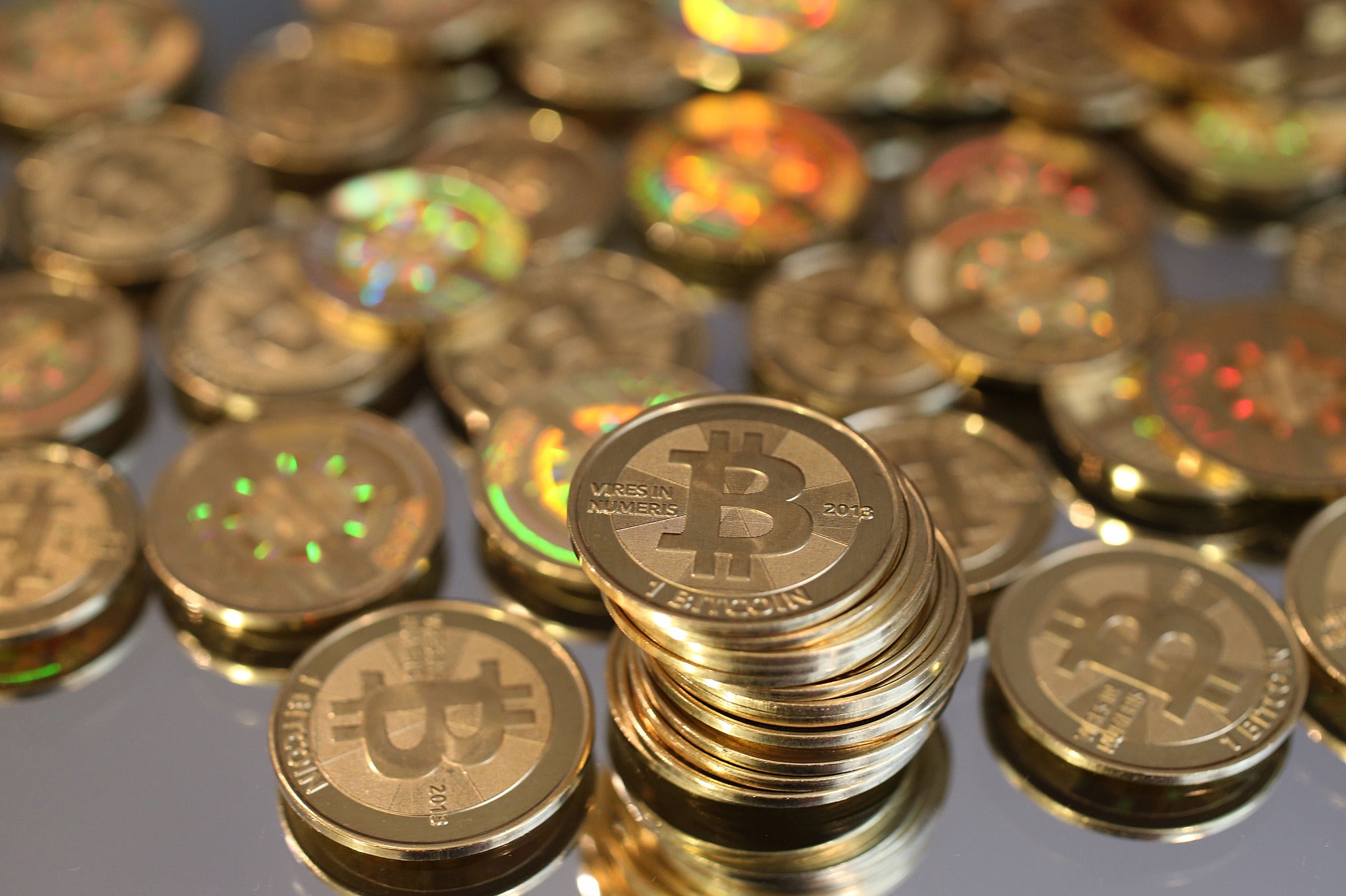 A pile of Bitcoins are shown here after Software engineer Mike Caldwell minted them in his shop on April 26, 2013 in Sandy, Utah. Bitcoin is an experimental digital currency used over the Internet that is gaining in popularity worldwide. (Photo by George