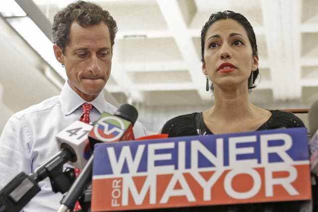 Anthony Weiner and his wife Huma Abedin at a press conference on Tuesday