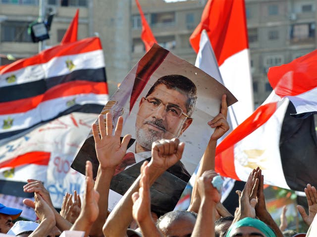 Mohamed Morsi supporters continue to hold a sit in outside Cairo's Rabaa al-Adawiya mosque
