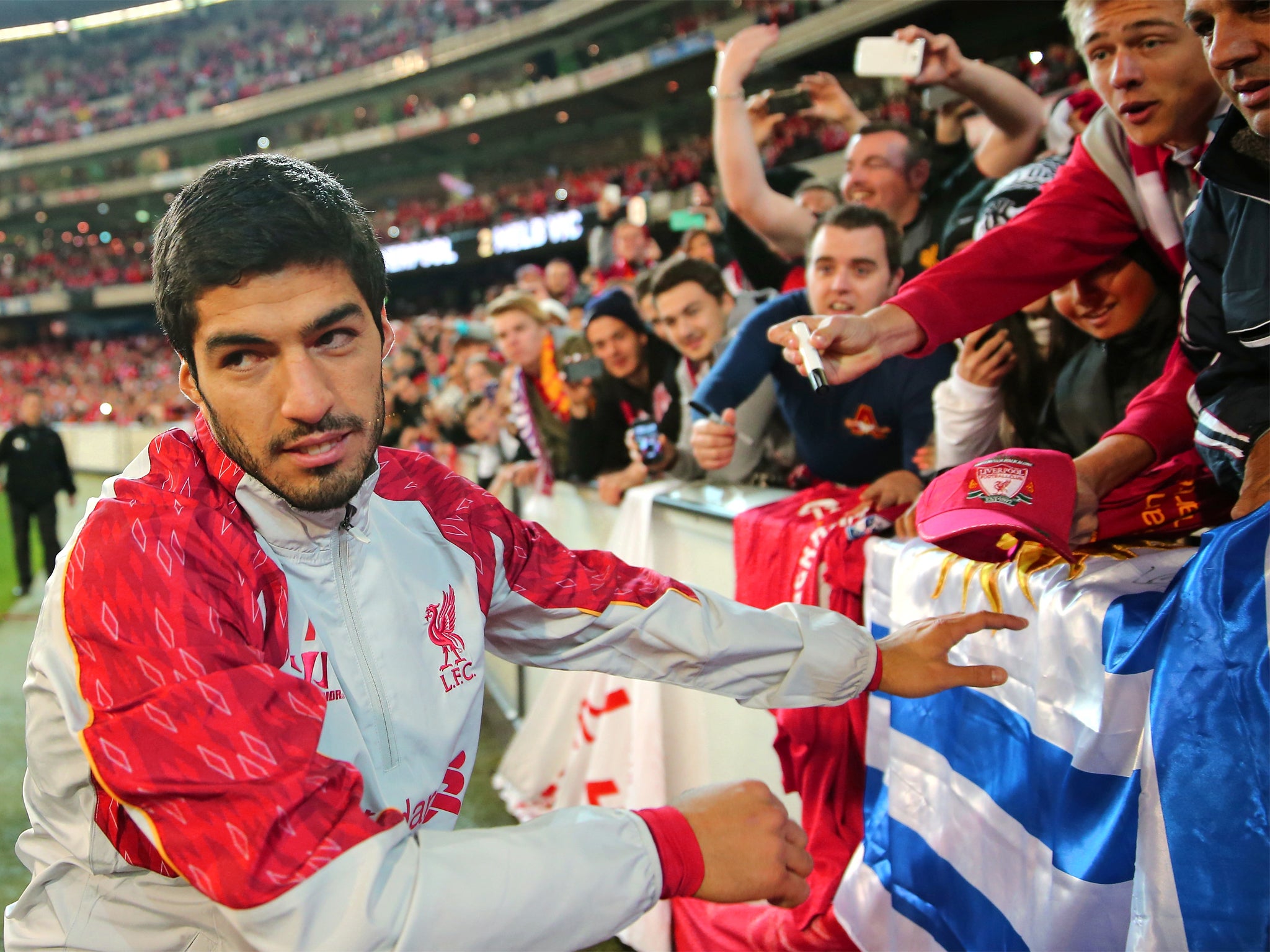 Luis Suarez meets fans after the match between Melbourne Victory and Liverpool in Australia