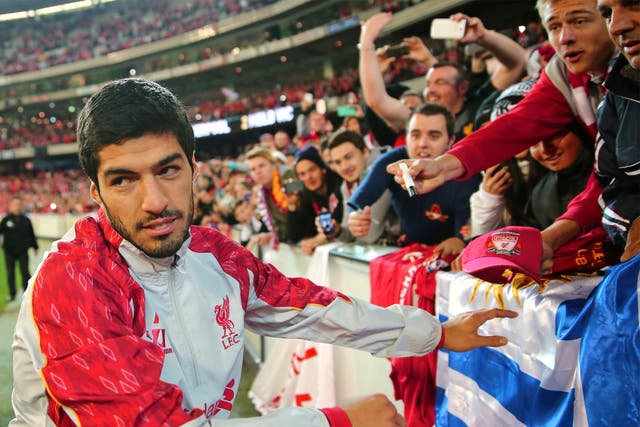 Luis Suarez meets fans after the match between Melbourne Victory and Liverpool in Australia