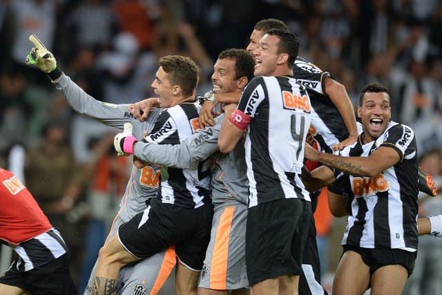 Atletico Mineiro's players celebrate after winning the Libertadores Cup 
