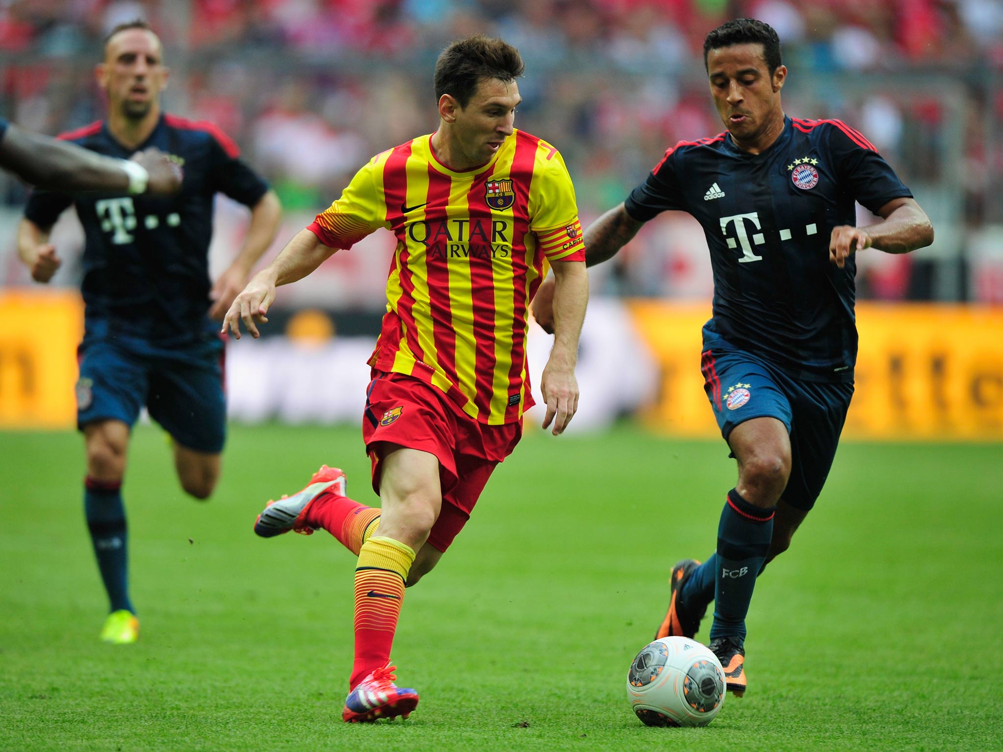 Lionel Messi in action against Bayern Munich's Thiago Alcantara
