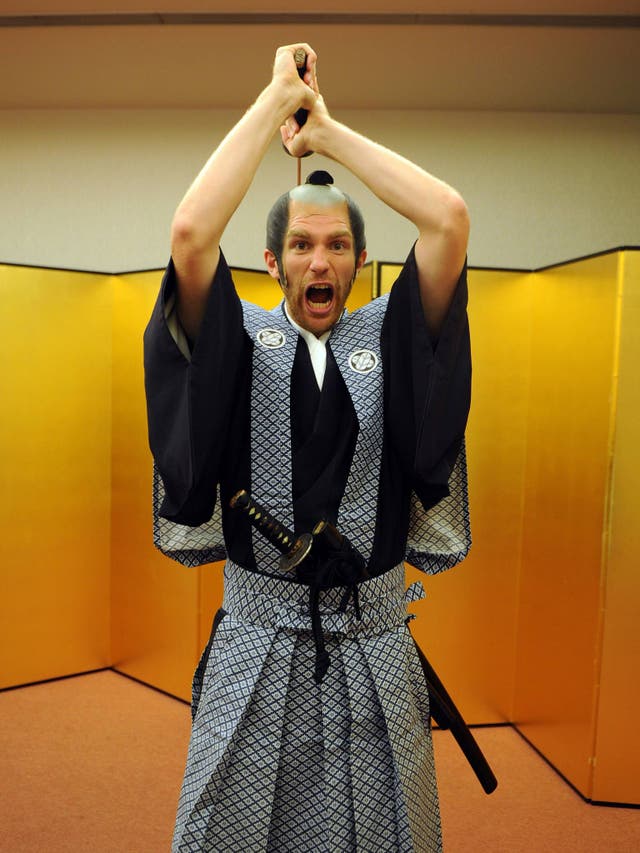 Per Mertesacker of Arsenal FC poses dressed as a Samurai Warrior in the Urawa Royal Pines Hotel in Japan