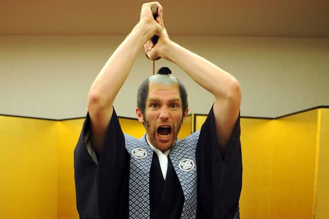 Per Mertesacker of Arsenal FC poses dressed as a Samurai Warrior in the Urawa Royal Pines Hotel in Japan
