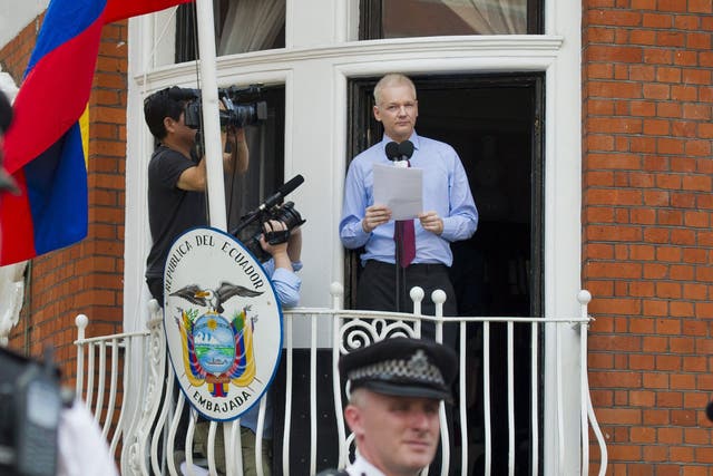 Julian Assange delivers a statement on the balcony at the Ecuador Embassy on 19 August 2012
