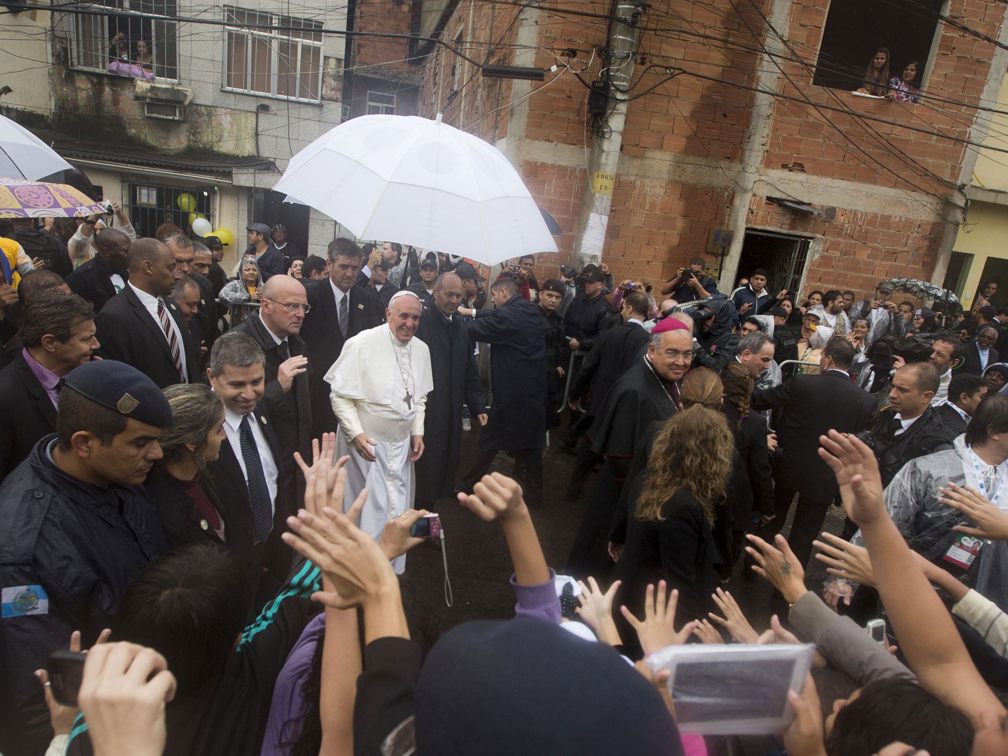 Pope Francis receives a warm welcome as he visits the Varginha slum