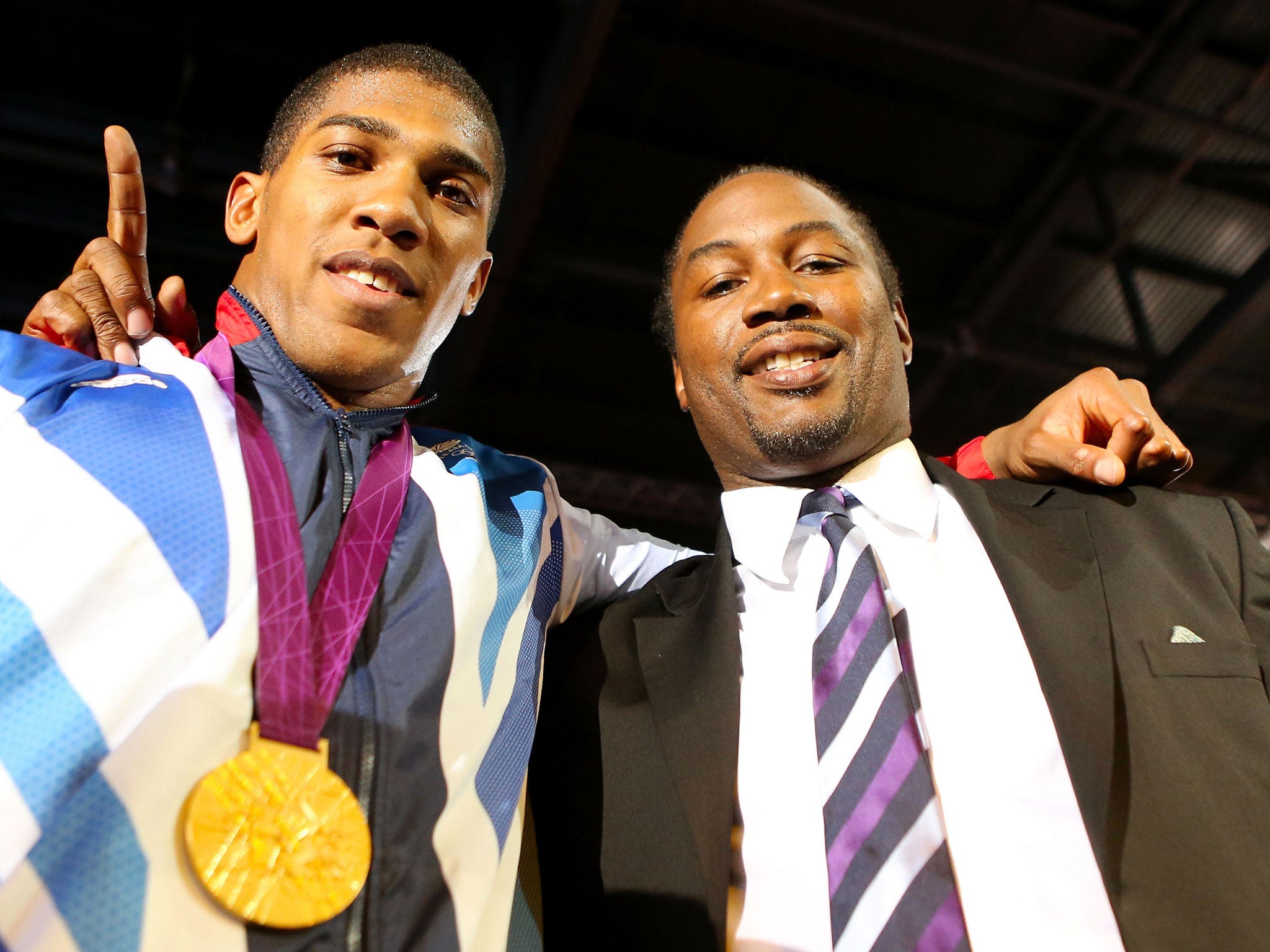 Anthony Joshua (left) with Lennox Lewis at the Olympics
