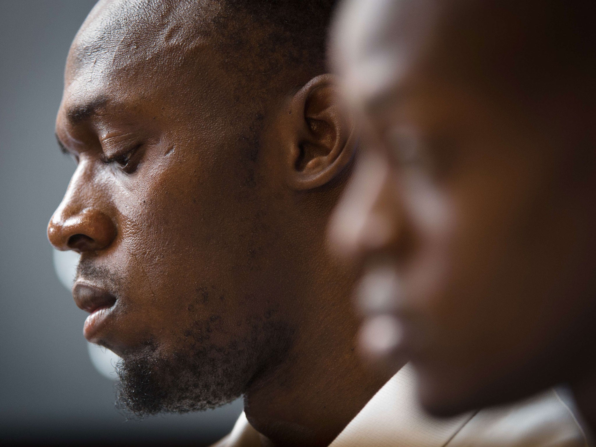 Jamaican sprinter Usain Bolt (L) and British sprinter James Dasaolu attend a press conference in central London