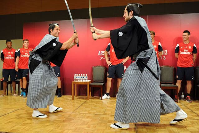 Lukas Podolski and Per Mertesacker pose as Samurai warriors on Arsenal’s pre-season tour of Japan