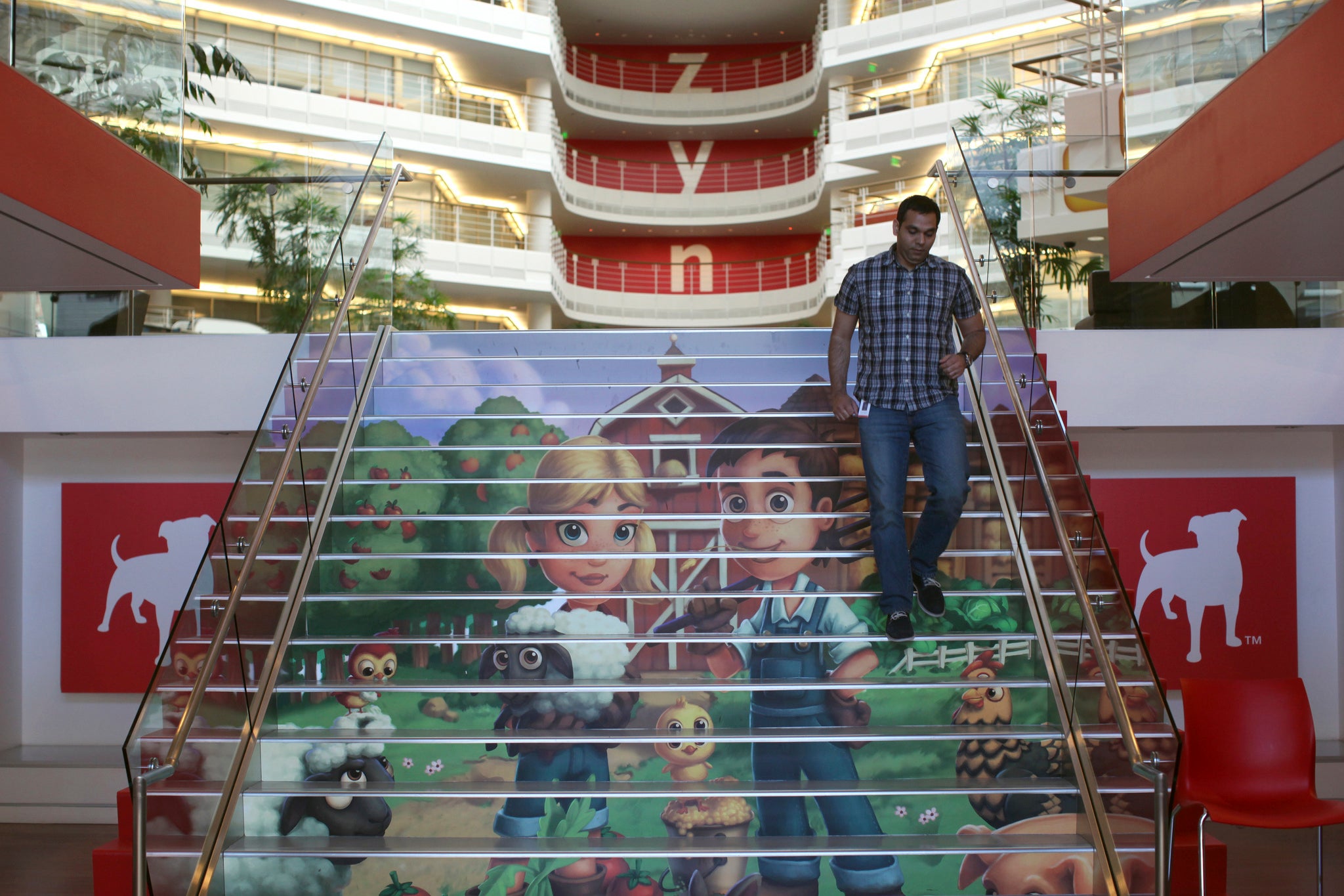 Player avatars from Zynga's FarmVille 2 are seen on a stairway at the entrance to Zynga headquarters in San Francisco, California April 23, 2013. REUTERS/Robert Galbraith