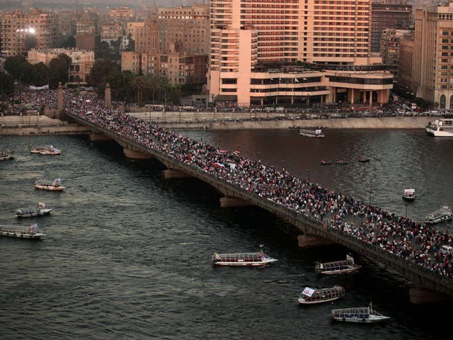 Supporters of Egypt's top military officer, Gen. Abdel-Fatah el-Sissi rally over a bridge leading to Tahrir Square in Cairo