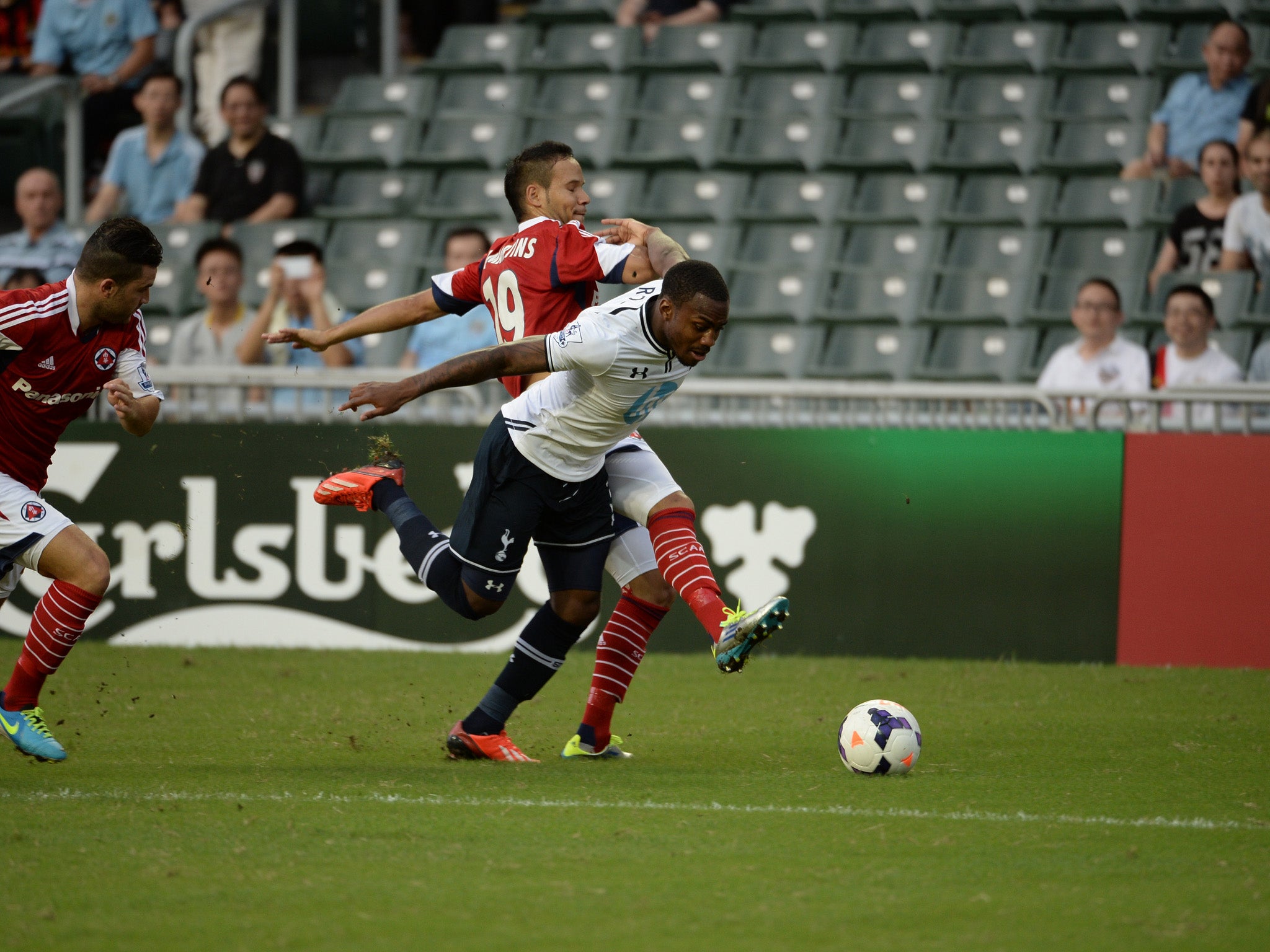 Tottenham Hotspur's Daniel Rose competes South China's Dhiego De Souza Martins during their Barclays Asia trophy third place match