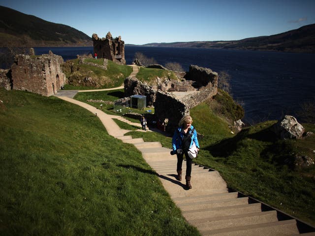 Tourists visit Urquhart Castle on Loch Ness