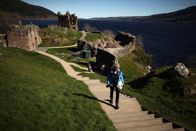 Tourists visit Urquhart Castle on Loch Ness
