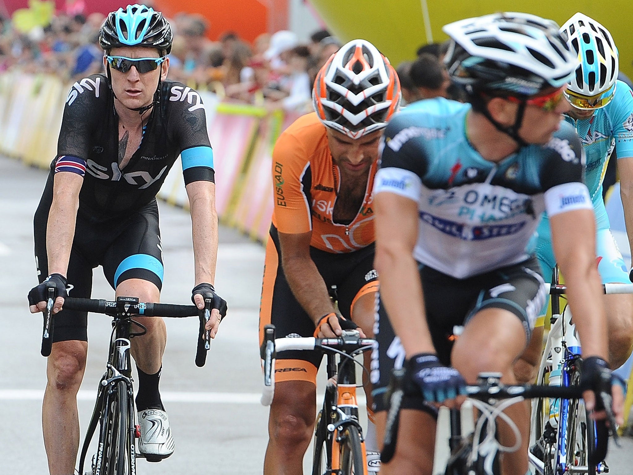Back pedalling: Sir Bradley Wiggins (left) finishes the first stage