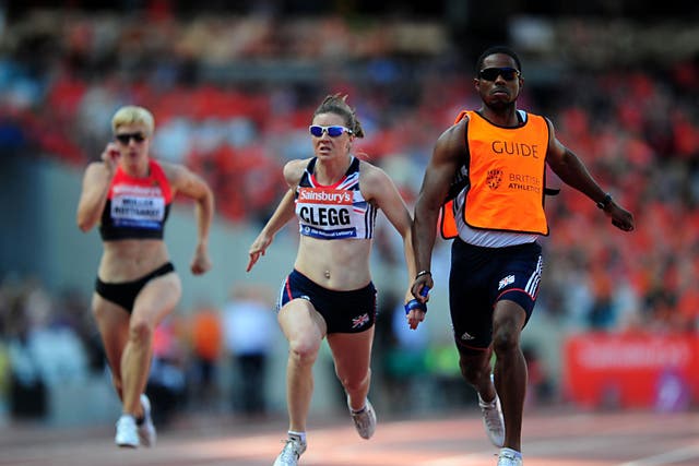 Great Britain's Libby Clegg, centre, during the Women's T12 100 metres during the Sainsburys International Para Challenge at the Olympic Stadium, London