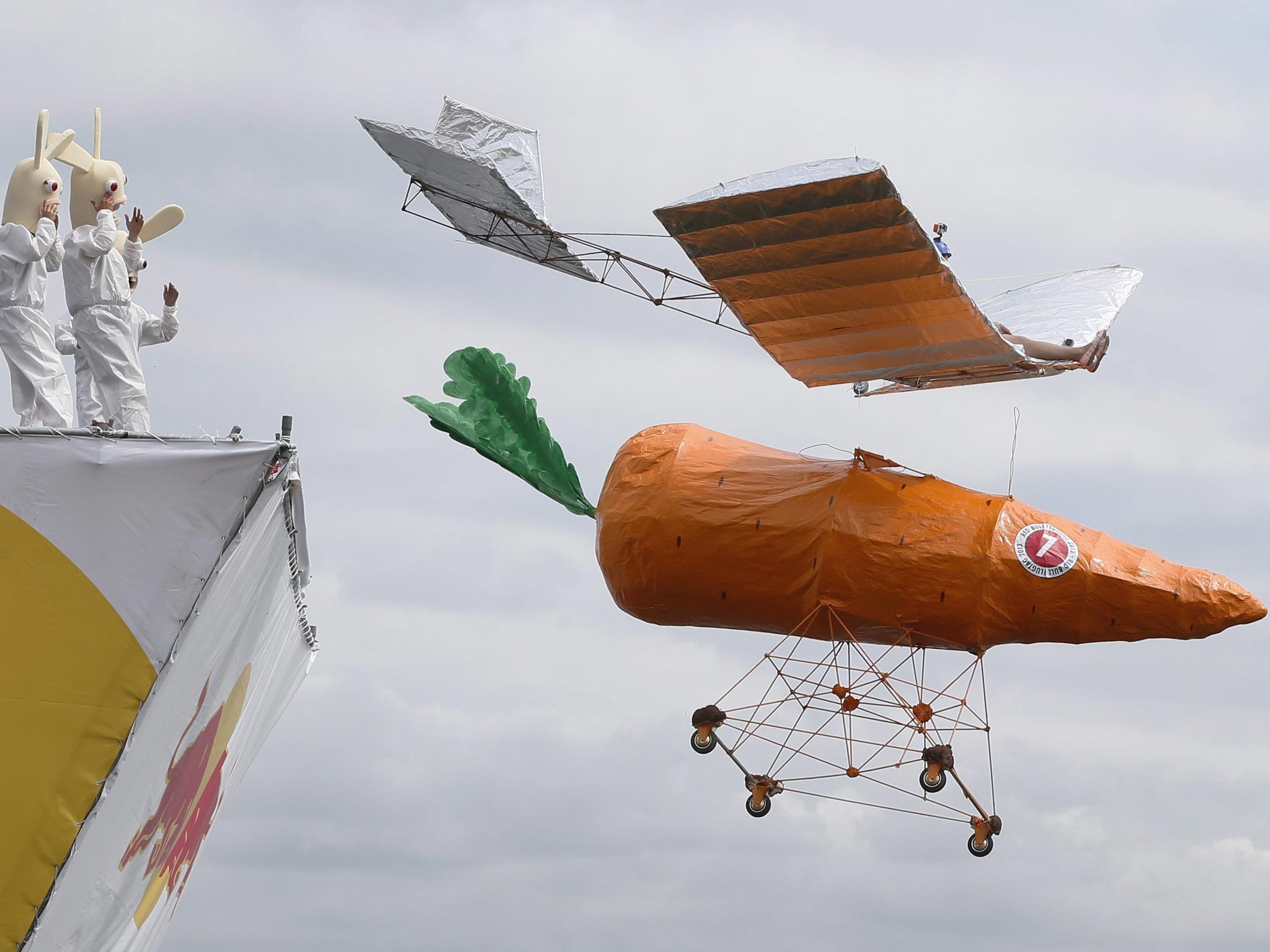 A team member pilot on his carrot-shaped flying machine