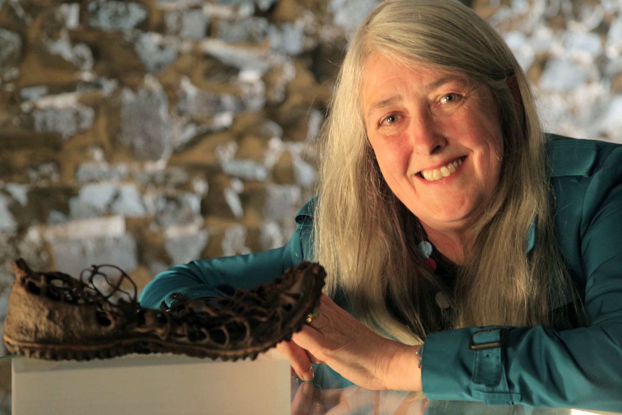 Mary Beard with an ancient Roman caligae at the Xanten Museum
