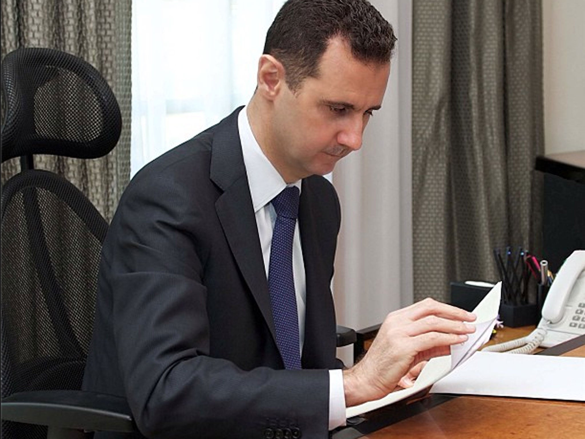 Bashar al-Assad working in his office