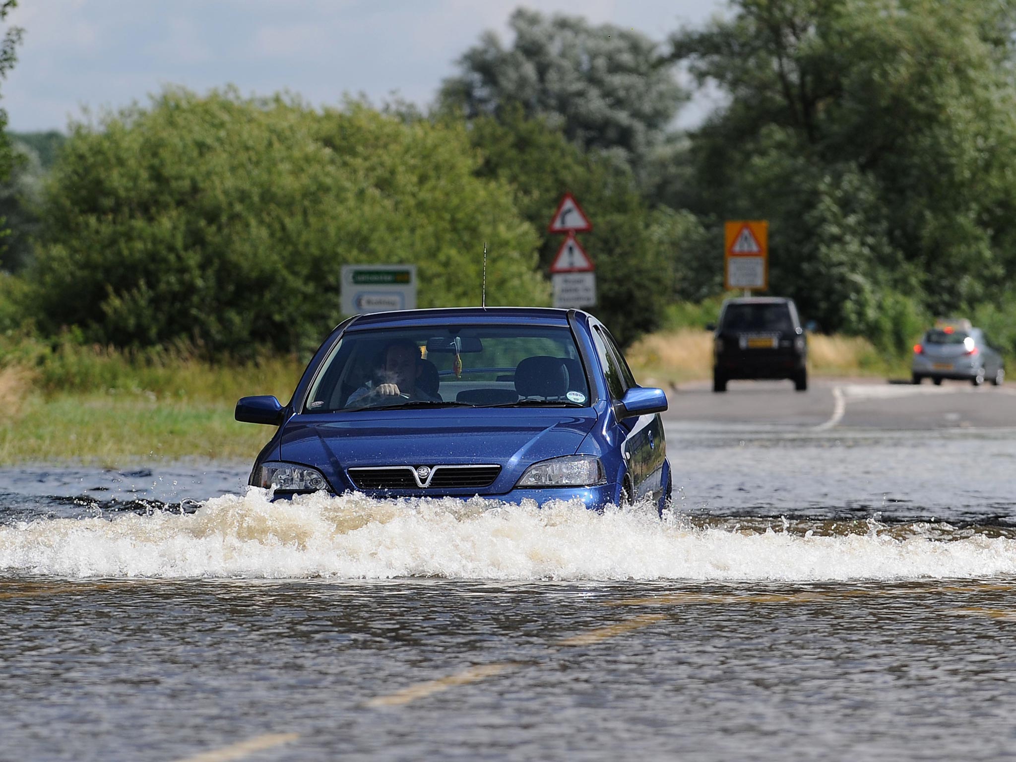 Motorists make their way through flood water in Loughborough