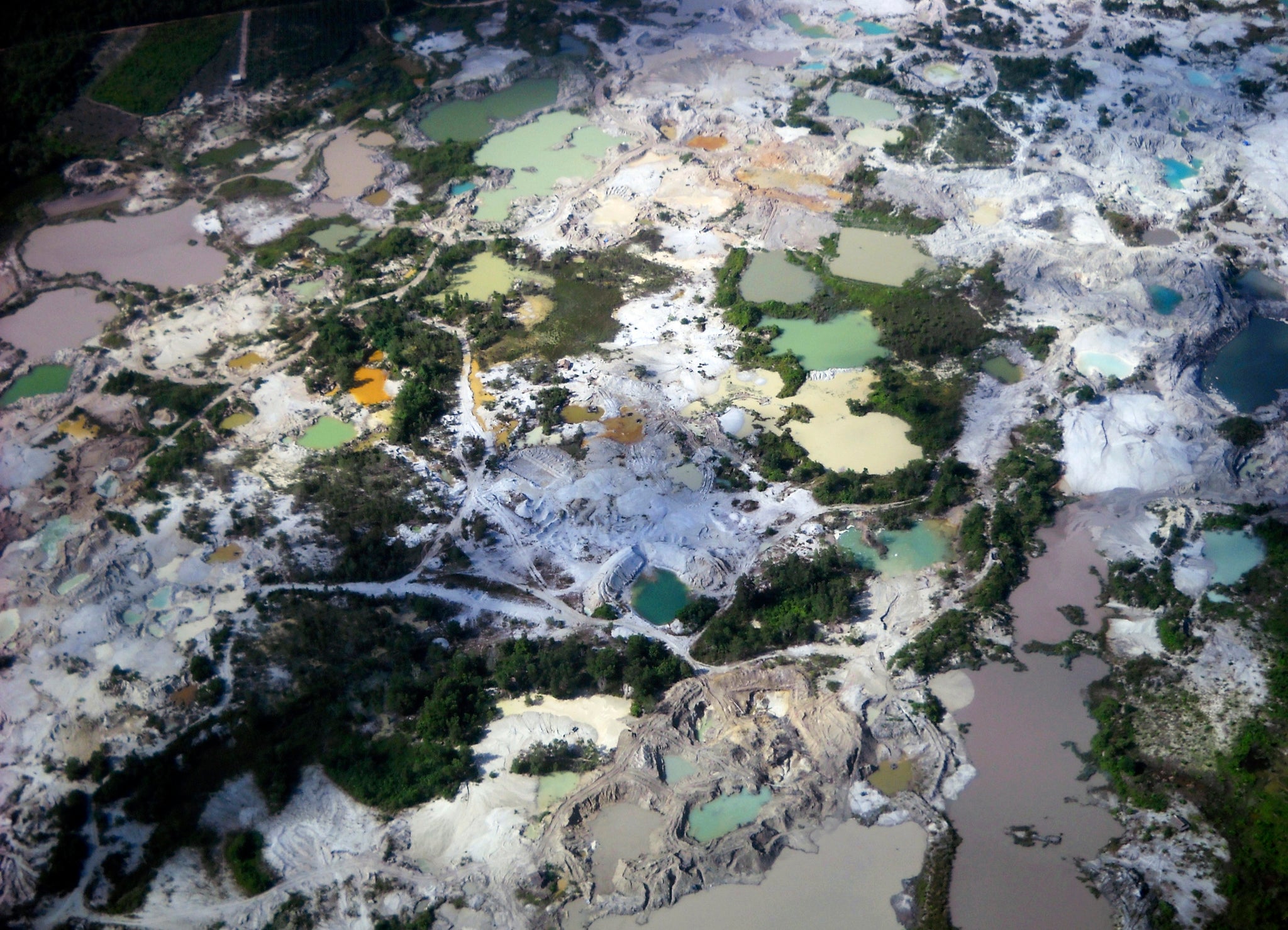 An aerial view of the environmental damage caused by tin mining in Indonesia's Bangka Belitung province May 18, 2010. REUTERS/Dwi Satmoko