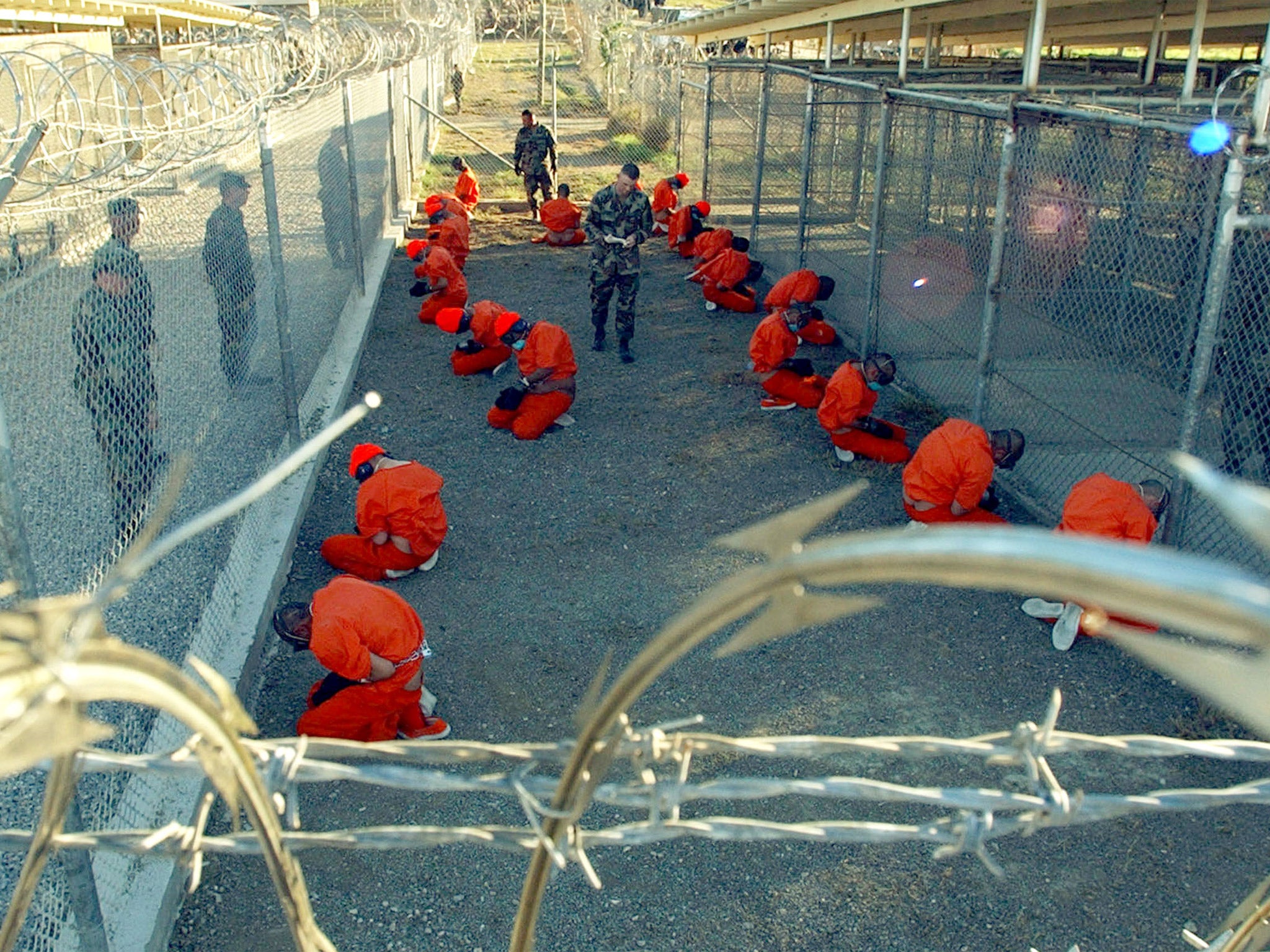 Prisoners in a holding area at Guantanamo Bay, Cuba