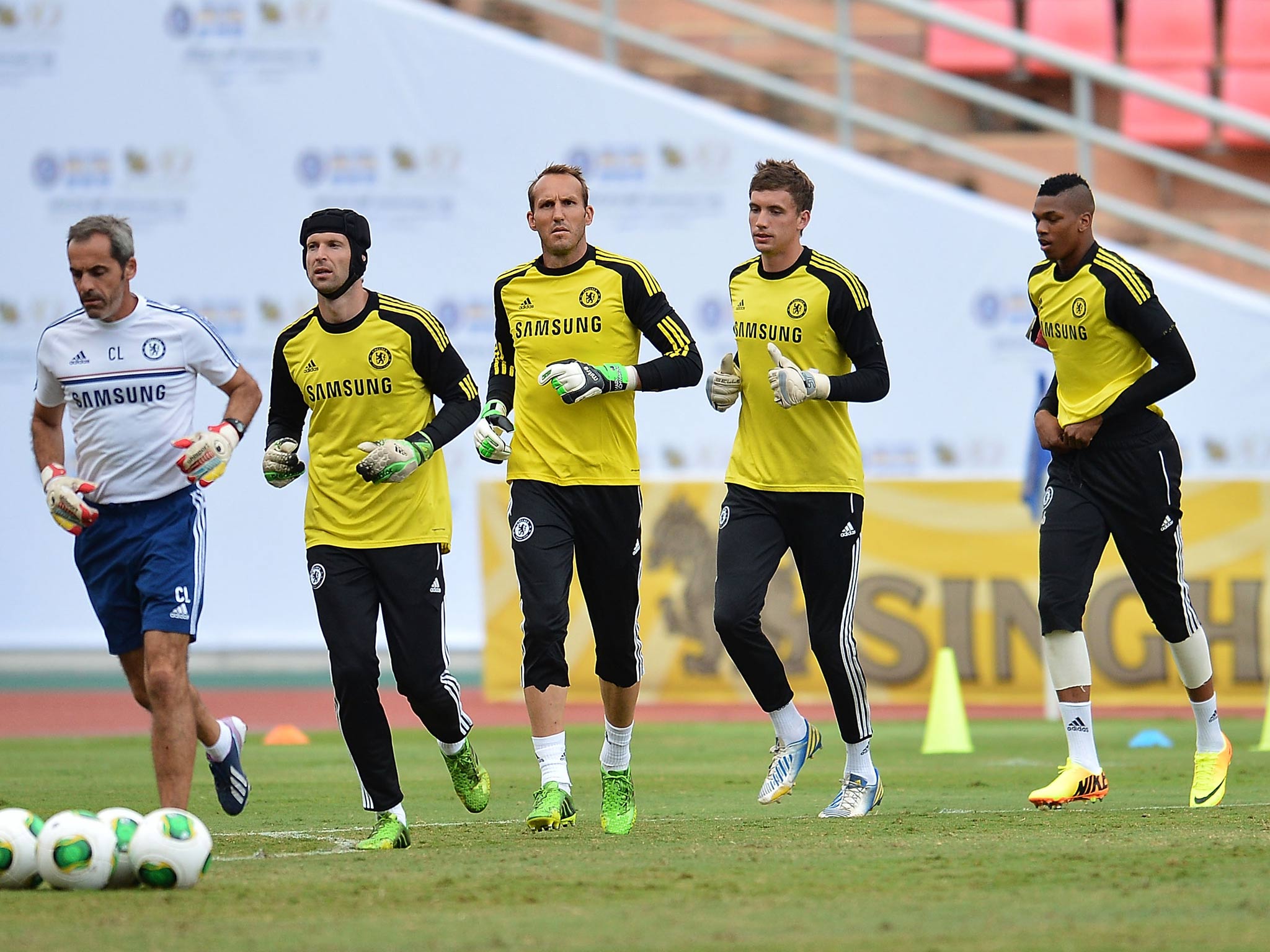 Peter Cech, Mark Schwarzer, Henrique Hilario and Jamal Blackman warm-up