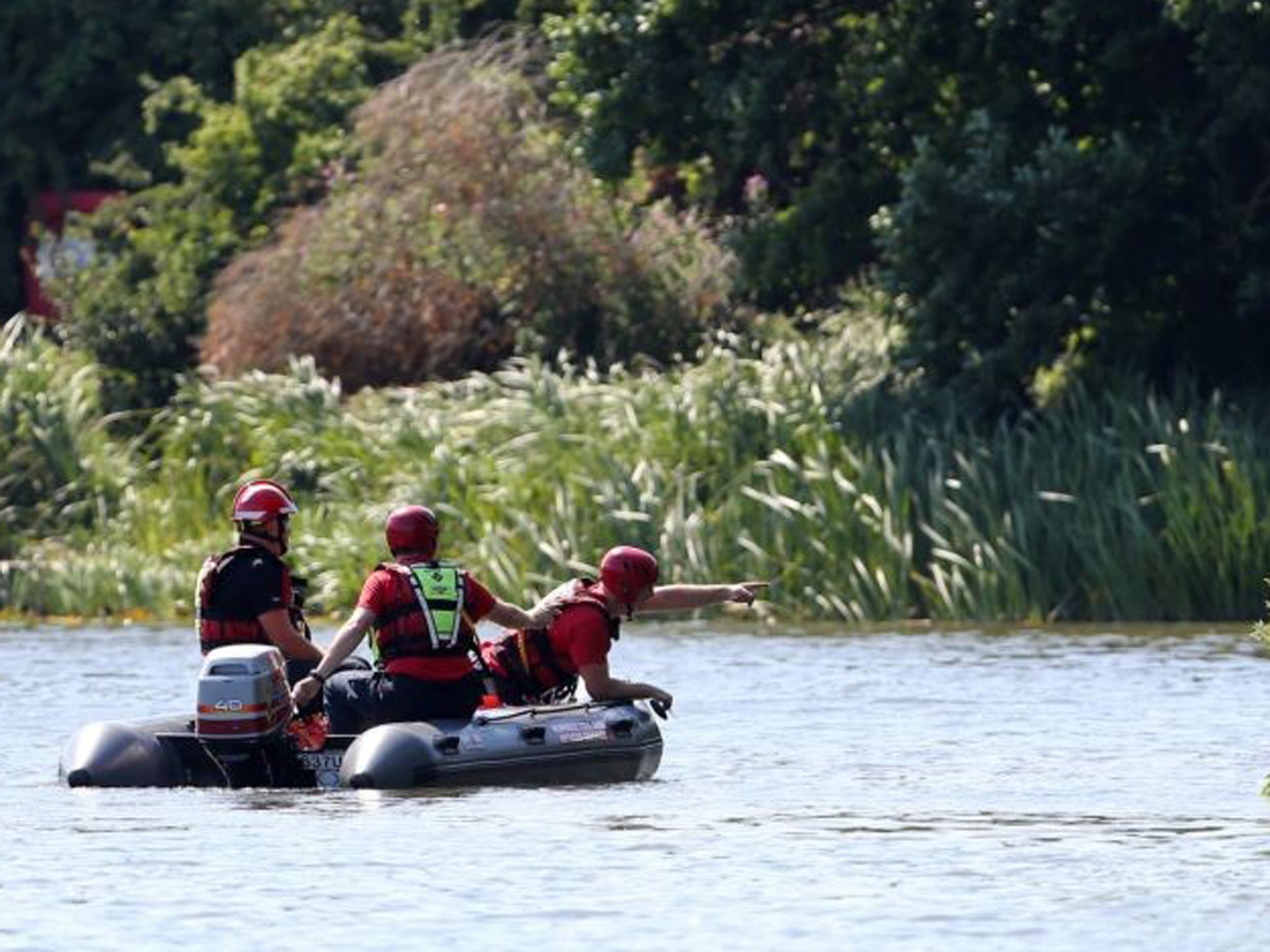 Norfolk Fire and Rescue search the Broad on the campus of the University of East Anglia
