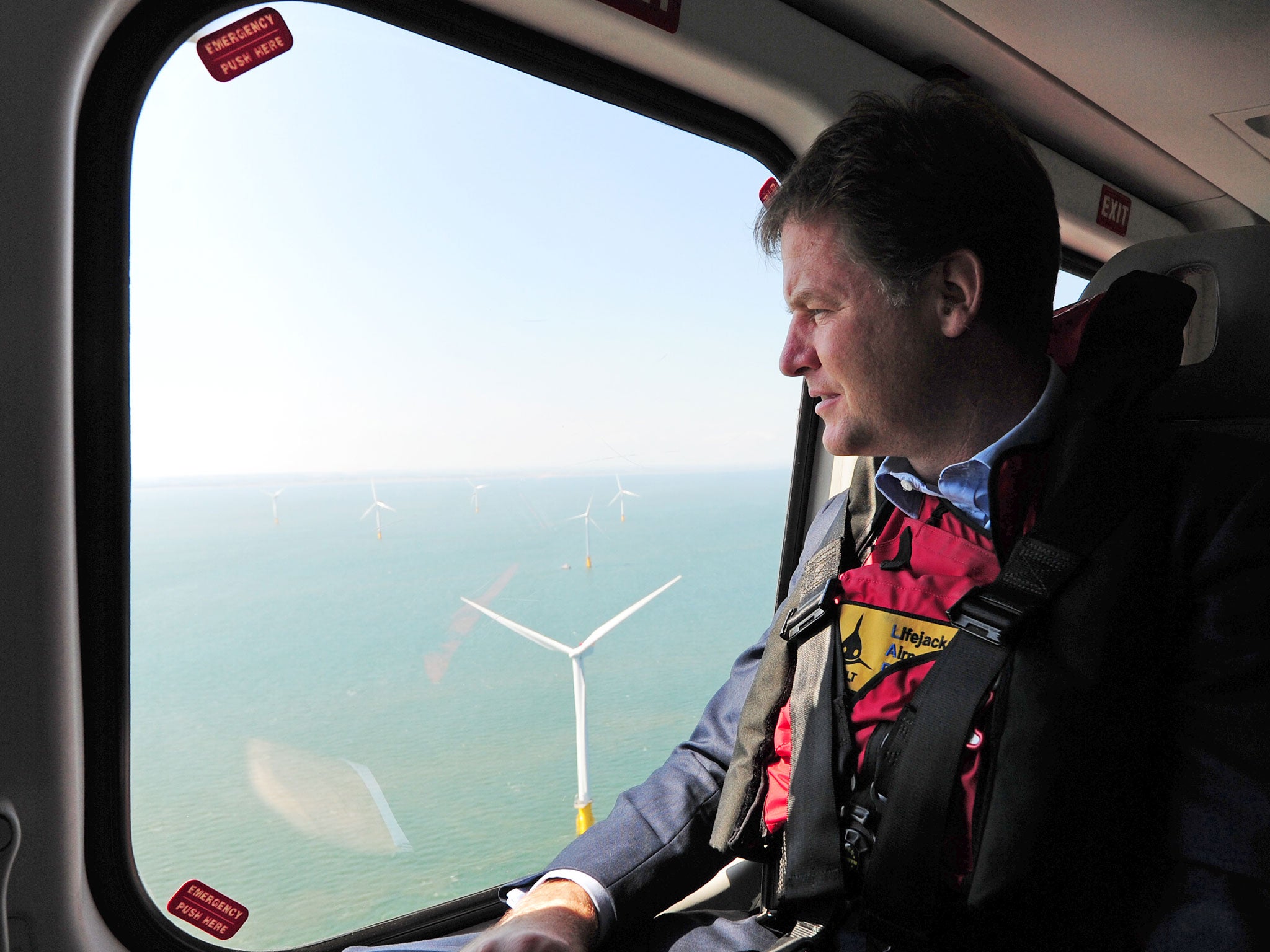Nick Clegg looks out of a helicopter window over the new Centrica Energy Lincs offshore wind farm off the Lincolnshire coast