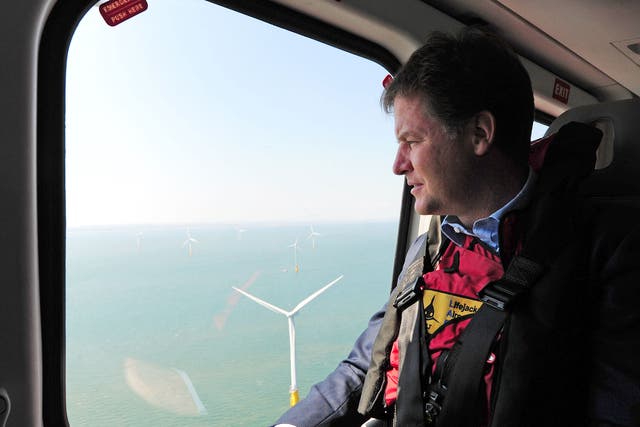 Nick Clegg looks out of a helicopter window over the new Centrica Energy Lincs offshore wind farm off the Lincolnshire coast