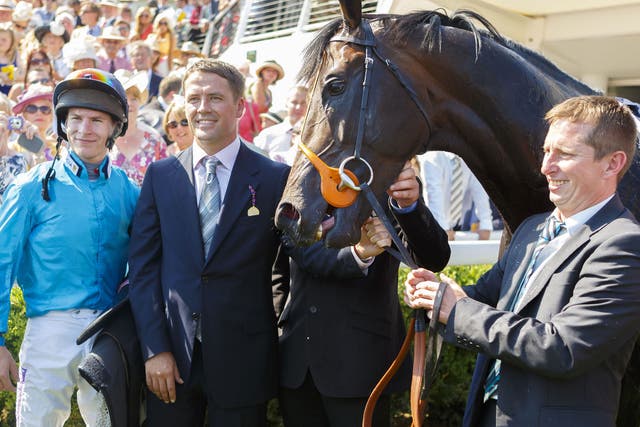Owner Michael Owen (second left) and jockey Richard Kingscote with Brown Panther after his Goodwood Cup win yesterday
