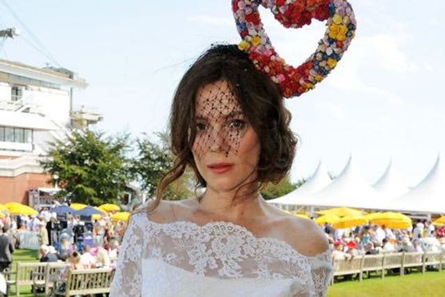 Is Anna Friel utterly in love? The British actress wore a striking heart-shaped hat made of colourful flowers and veil by London-based milliner Victoria Grant for the Glorious Goodwood at Goodwood Racecourse, Chichester
