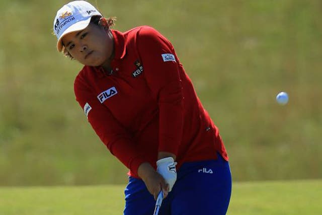 Inbee Park chips on the fourth hole yesterday