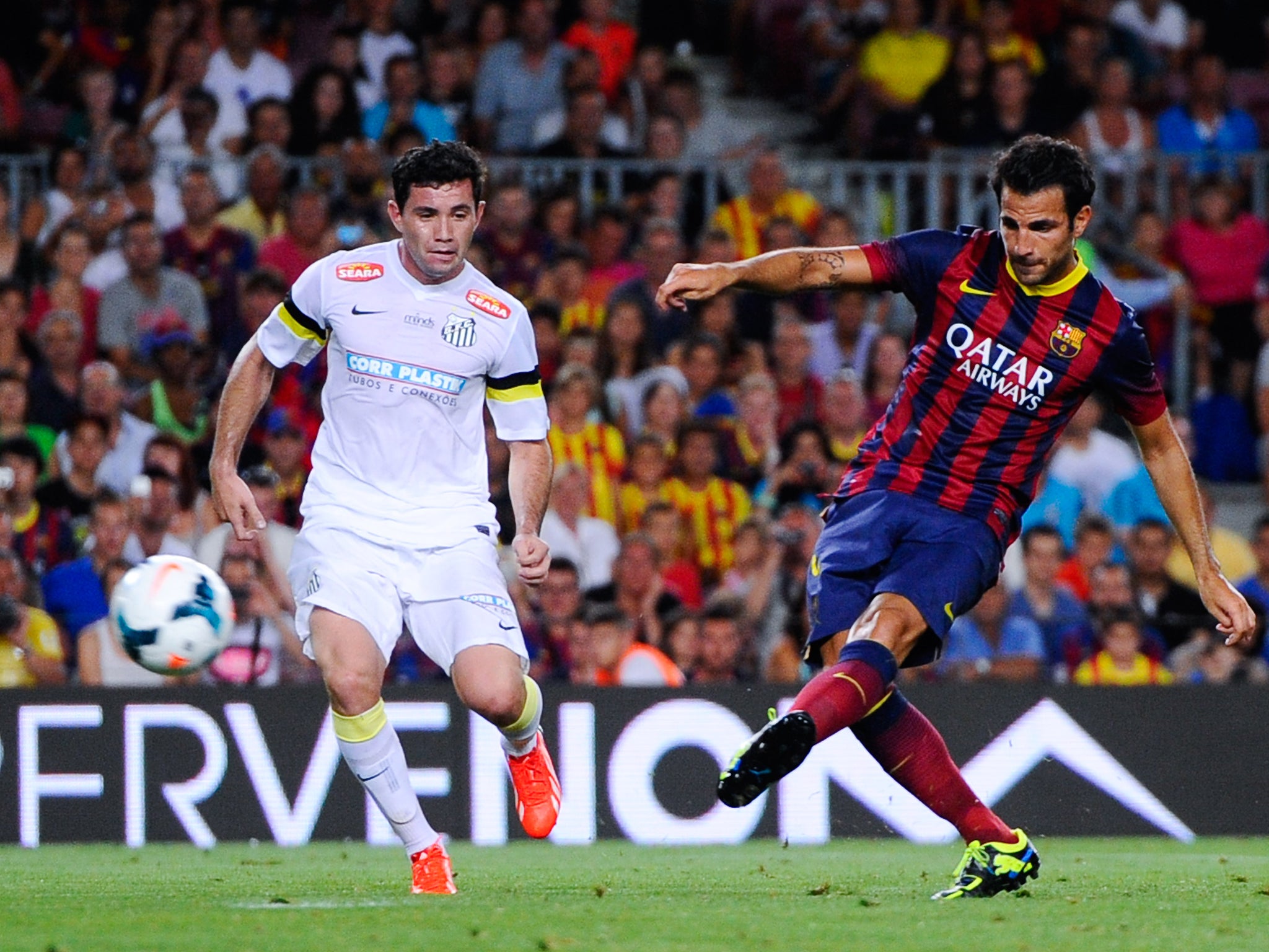 Cesc Fabregas scores Barcelona's sixth goal against Santos in the pre-season Gamper Cup