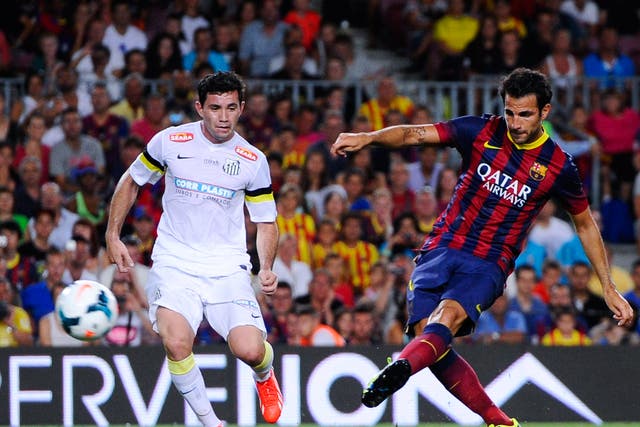 Cesc Fabregas scores Barcelona's sixth goal against Santos in the pre-season Gamper Cup