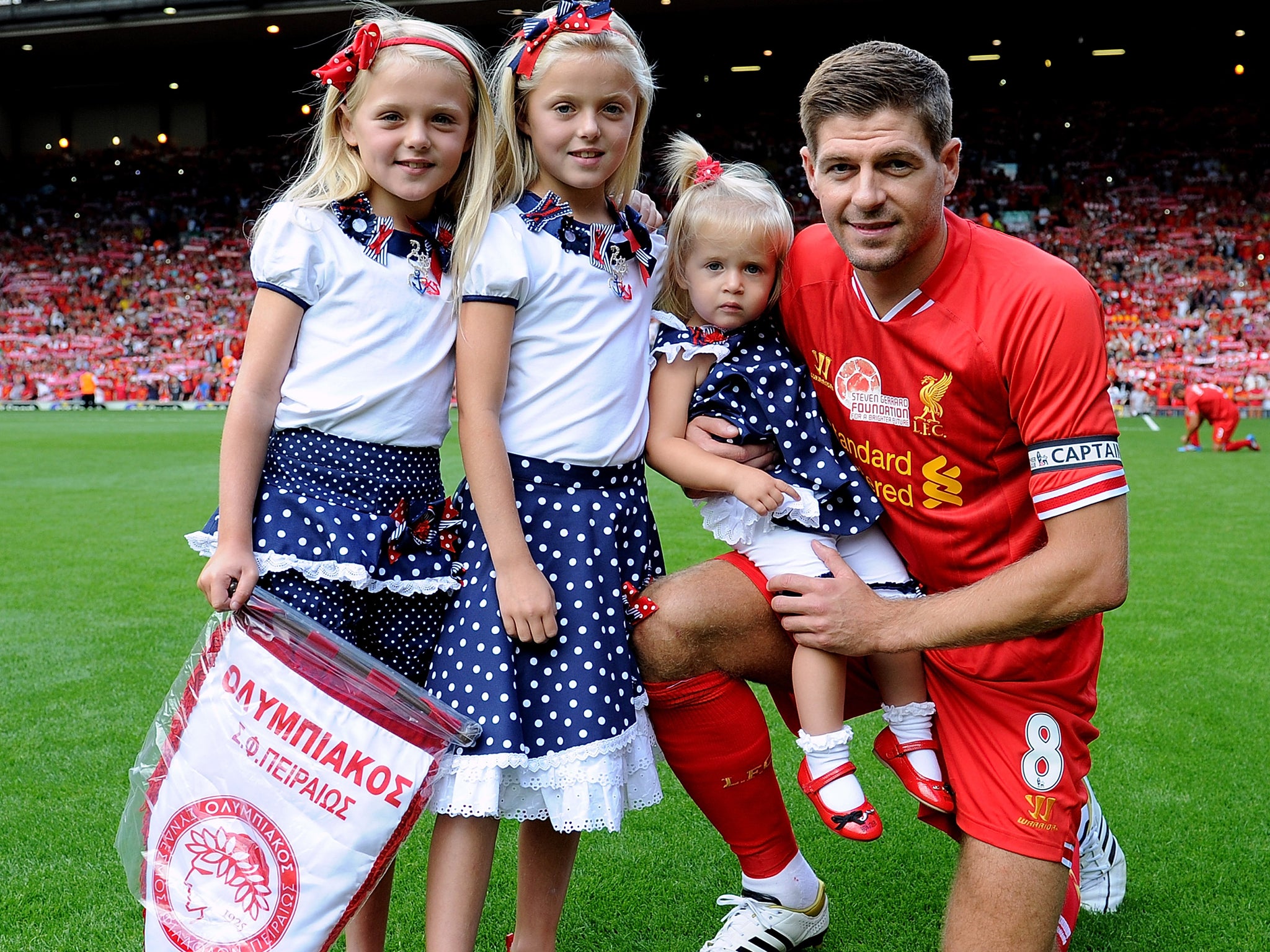Steven Gerrard poses with his daughters before his testimonial against Olympiacos