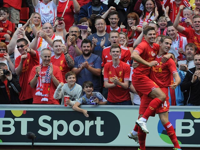 Liverpool duo Steven Gerrard and Jordan Henderson celebrate after the latter scored in the former's testimonial match against Olympiacos