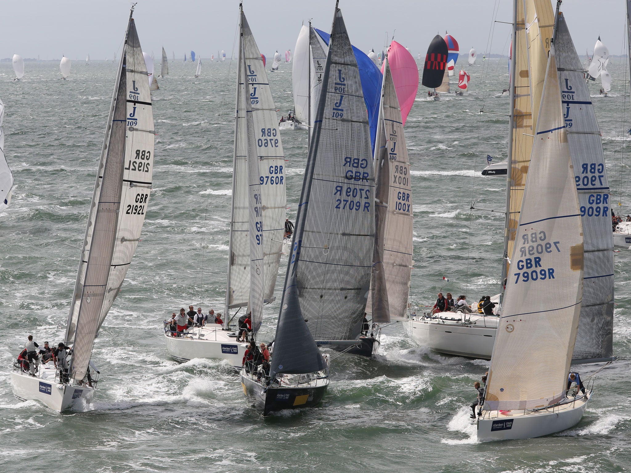 A jumble of J109s jostles for position approaching a mark rounding in the Solent on the second day of AAM Cowes Week.
