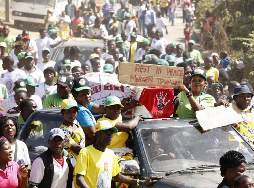 President Mugabe's supporters march against opposition party with mock funeral for their leader Morgan Tsvangirai
