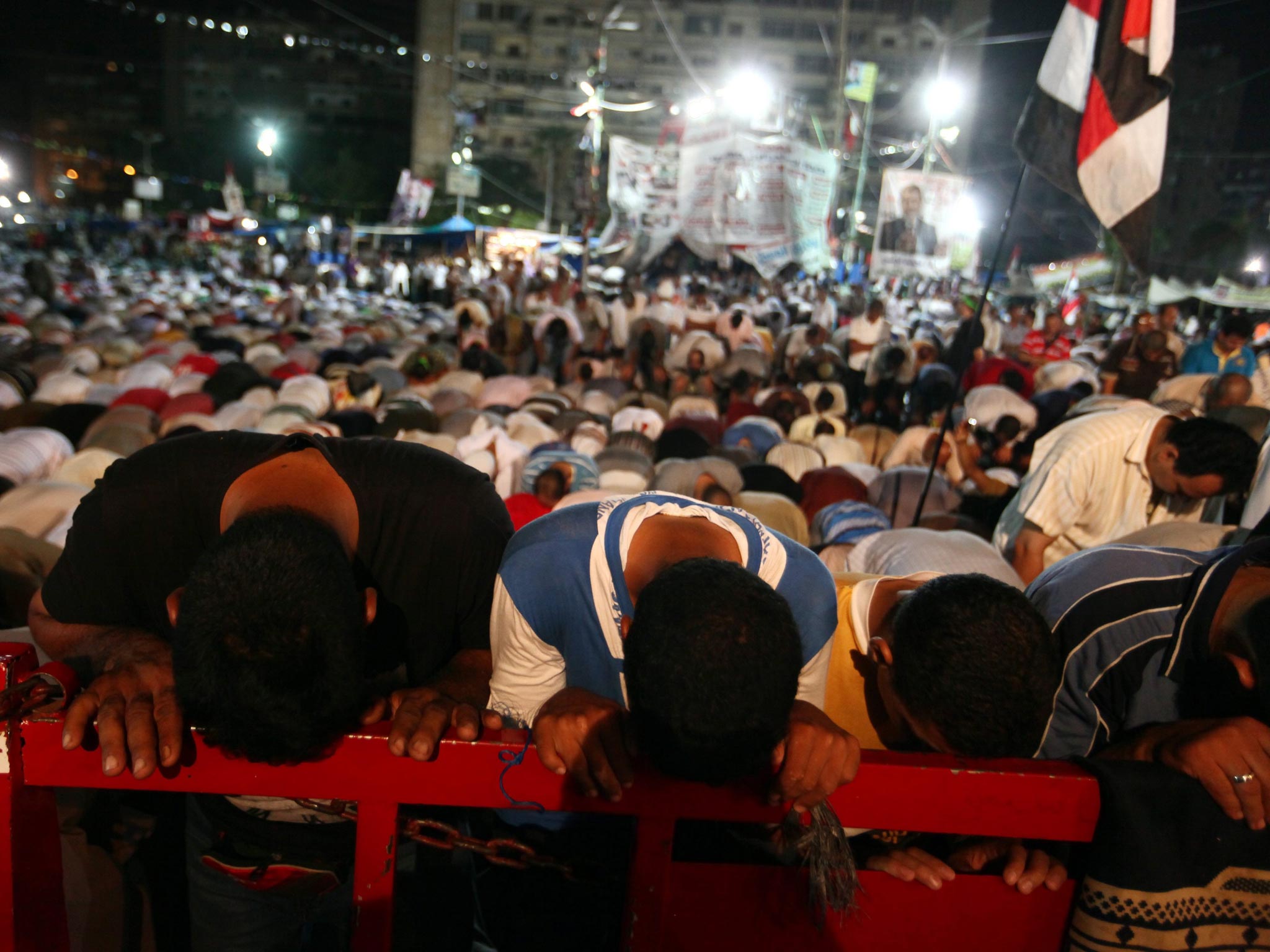 Egyptian Muslim Brotherhood members and supporters pray