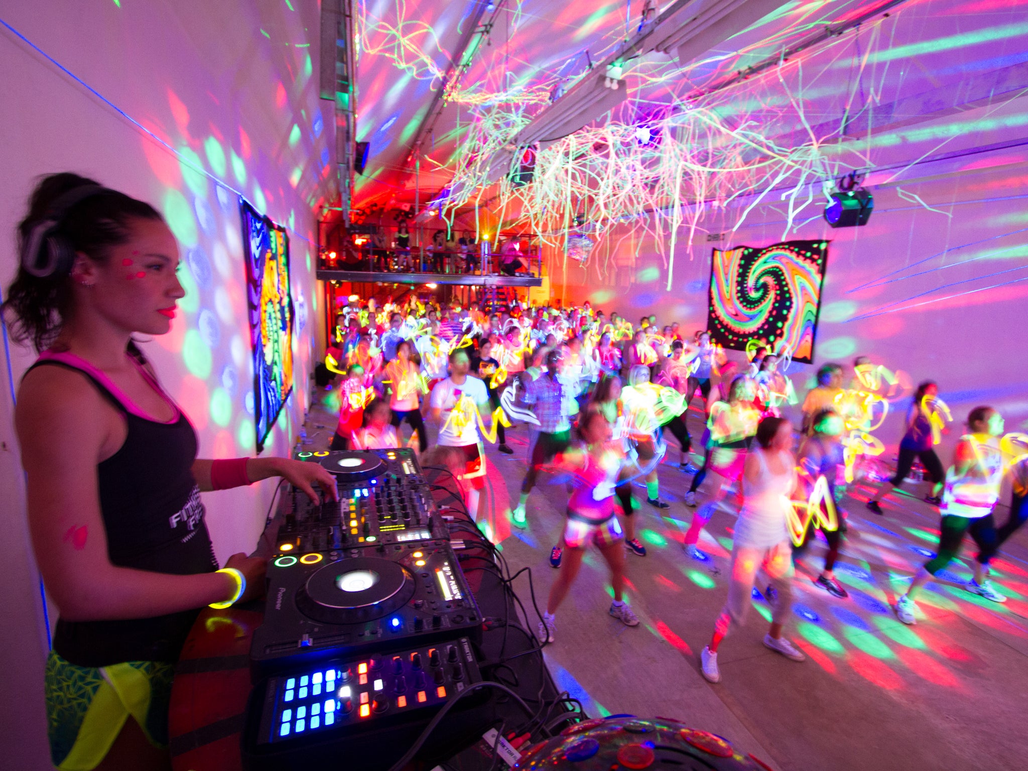 Move to the music: clubbers feel the beat at one of Fitness Freak's pop-up raves in London. The idea of fitness parties originated in the United States