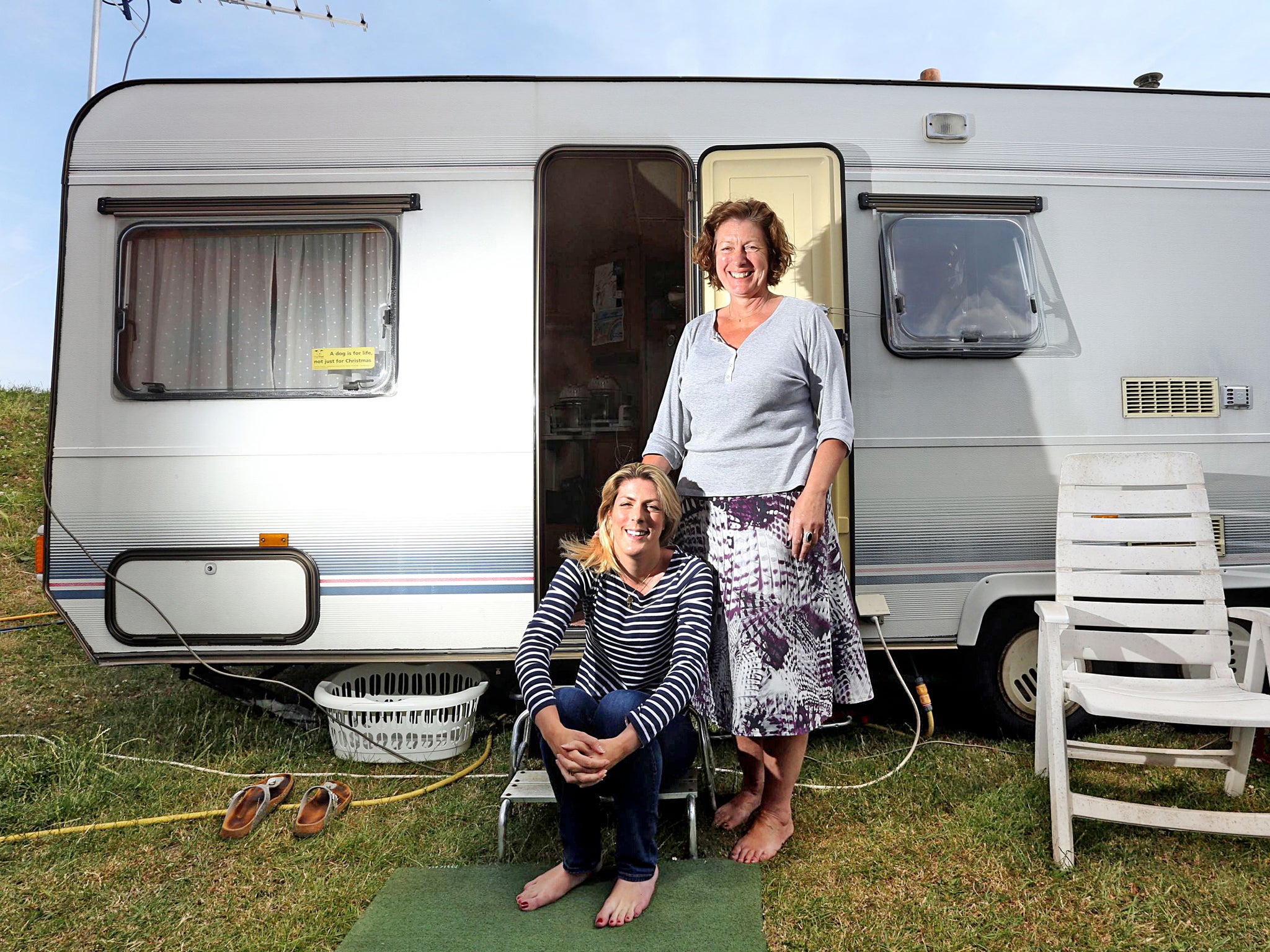 Fairground attraction: Zoah Hedges-Stocks, 23, with her
mother Bernice outside their caravan