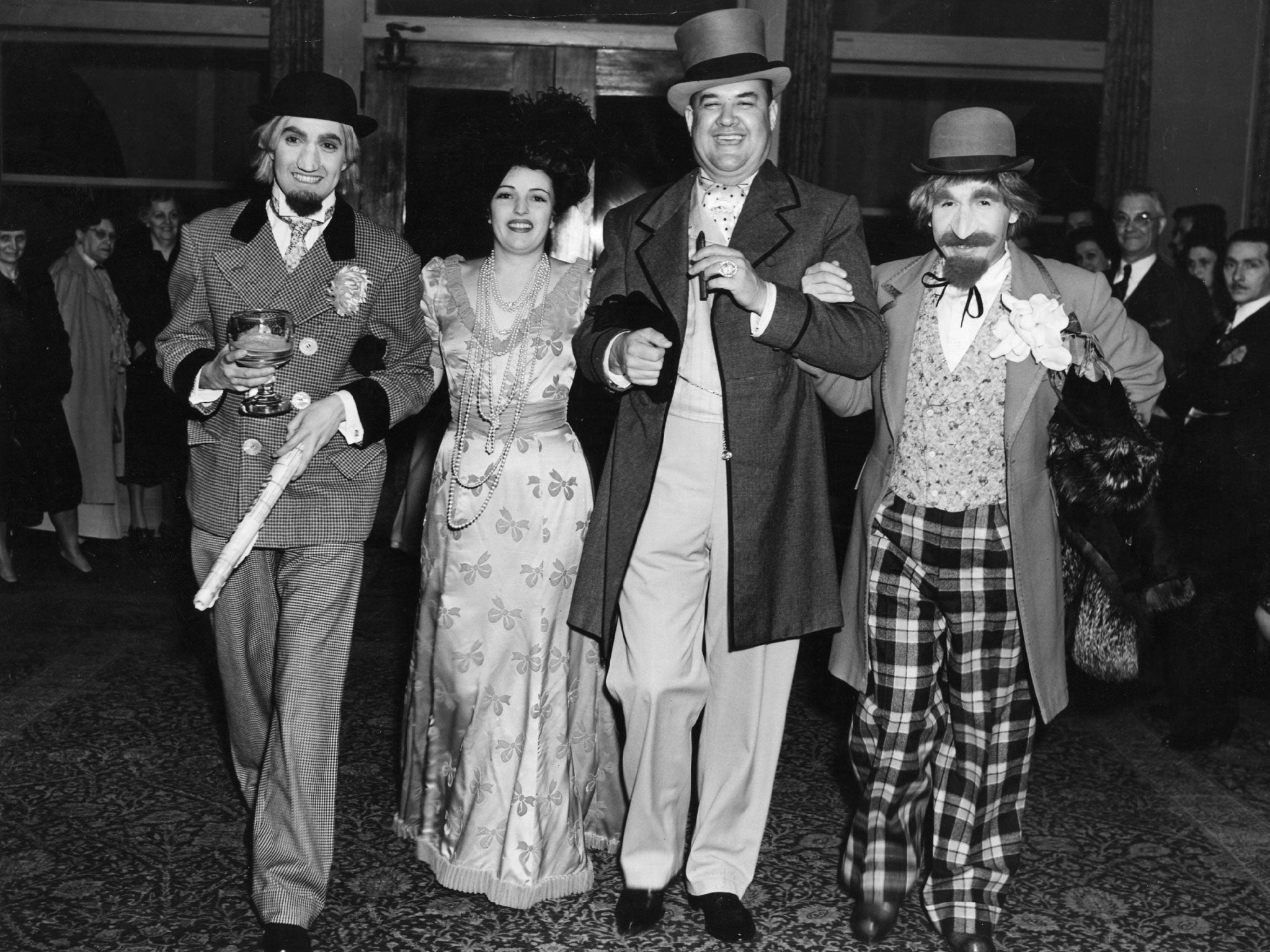 Tyrone Power, the American film actor with Julie Carter, Don Wilson and Jimmie Star in fancy dress at Edgar Bergen's party, held at the Beverly Hills Hotel.