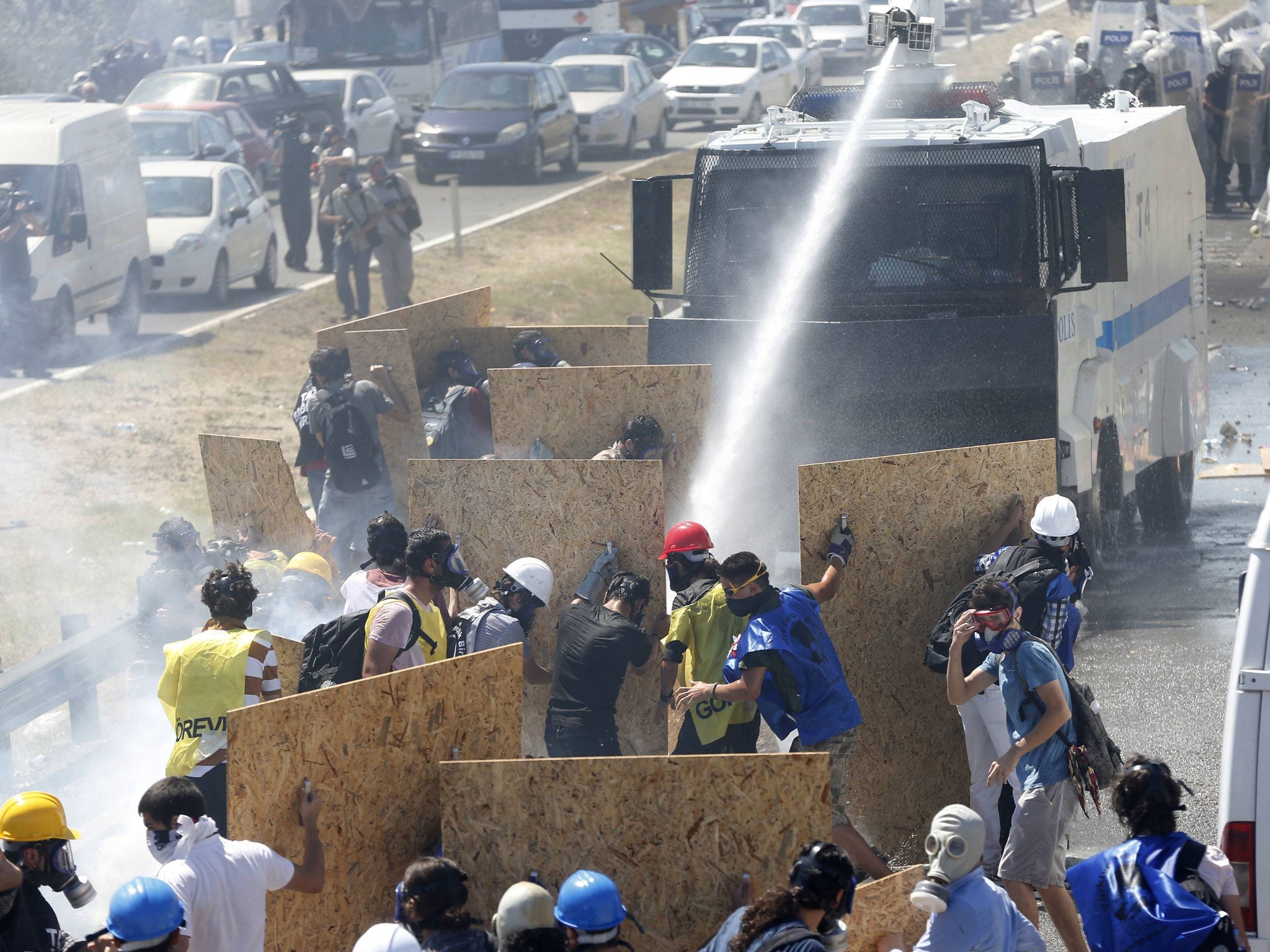 Riot police use water cannon and tear gas to disperse protesters as they try to march to a courthouse in Silivri