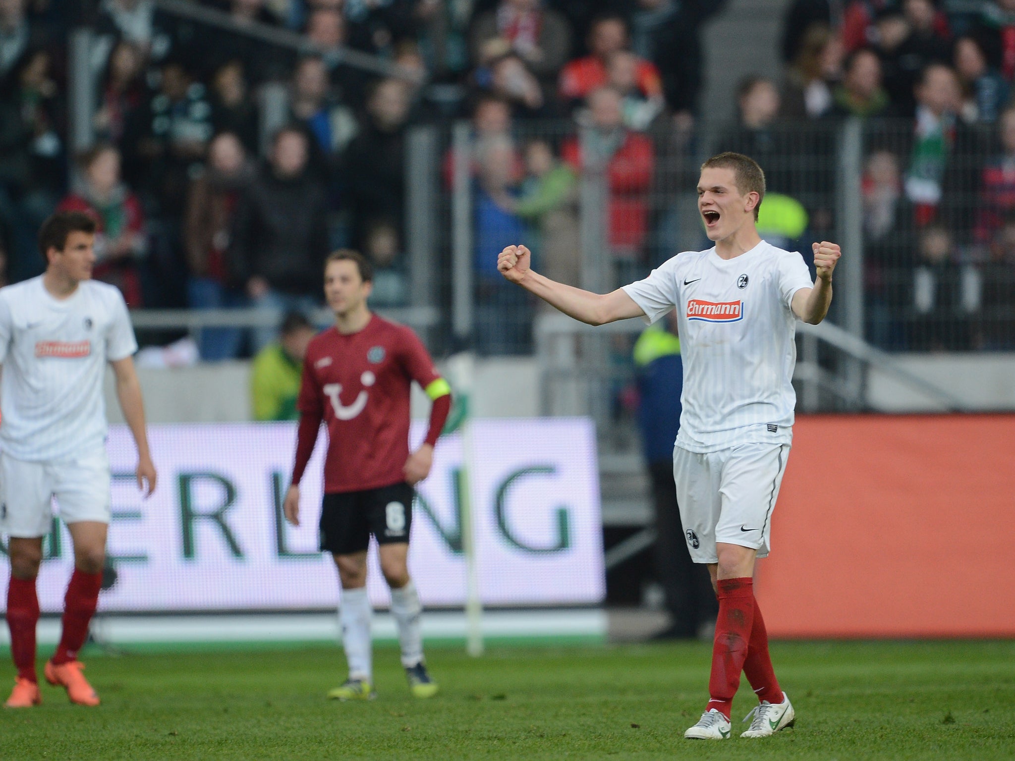 Matthias Ginter celebrates Freiburg's Bundesliga survival